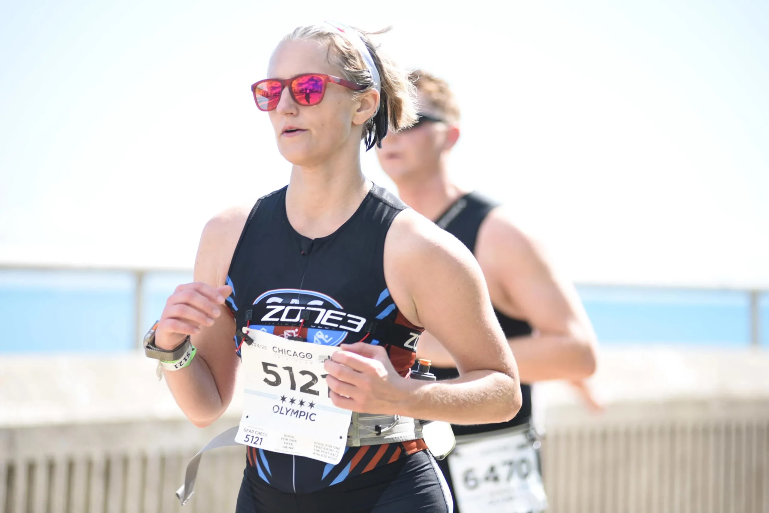 Dr. Jessica Rhodes running in a triathlon
