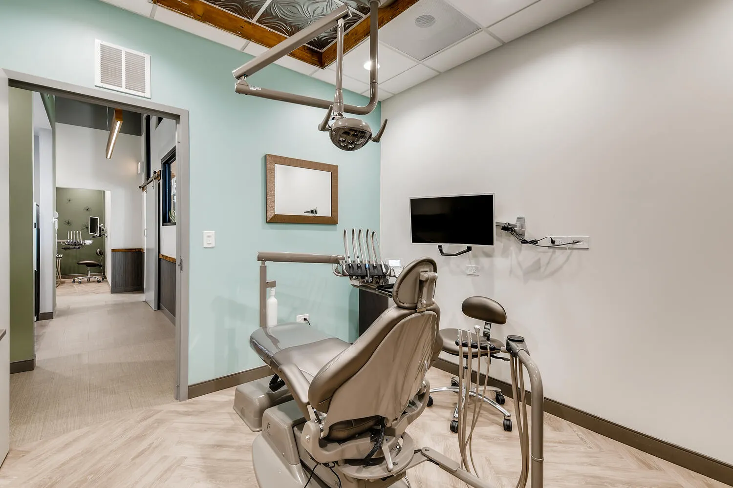 Clean, well-lit hallway connecting treatment rooms